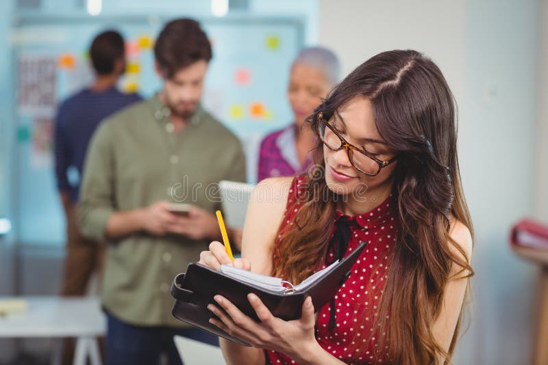 Female Business Executive Writing in Organizer Stock Image Image of
