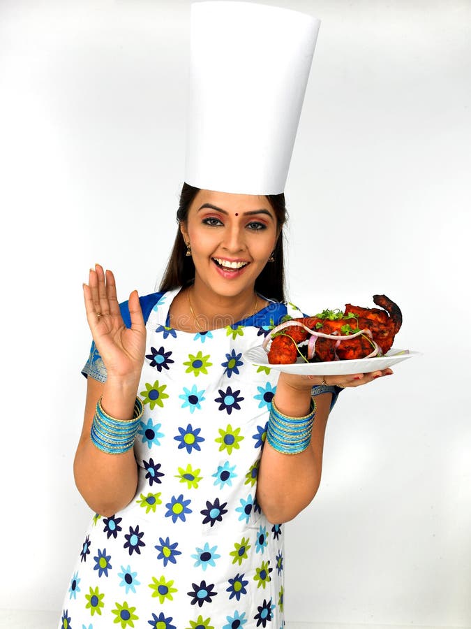 Female chef with her roasted chicken