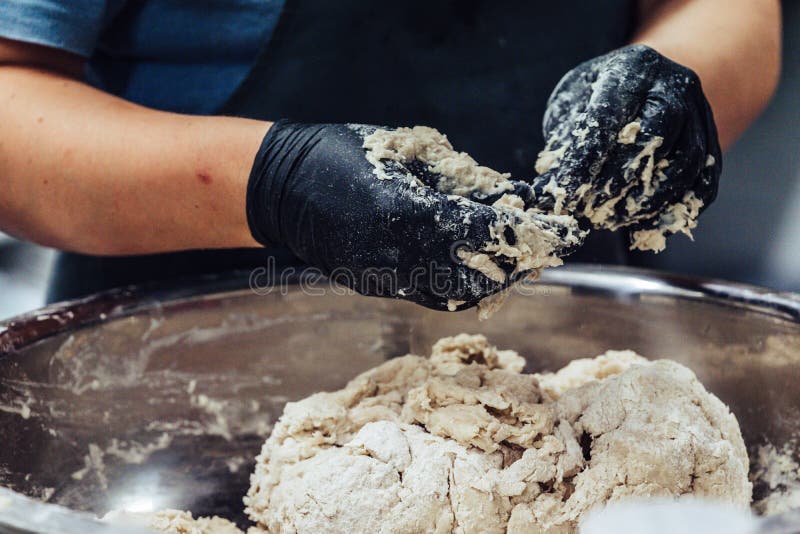 Female Chef Preparing Bread Dough for Self made Bread and Patties royalty free stock photography Female Chef Preparing Bread Dough for Self made Bread and Patties royalty free stock photography