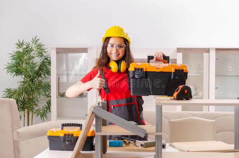 The Female Contractor Repairing Furniture at Home Stock Photo - Image ...