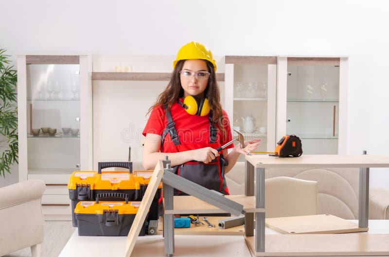 The Female Contractor Repairing Furniture at Home Stock Image - Image ...