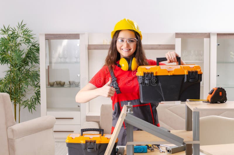 The Female Contractor Repairing Furniture at Home Stock Image - Image ...