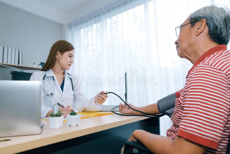 Female doctor checking blood pressure ff senior man patient. stock photo Female doctor checking blood pressure ff senior man patient. stock photo