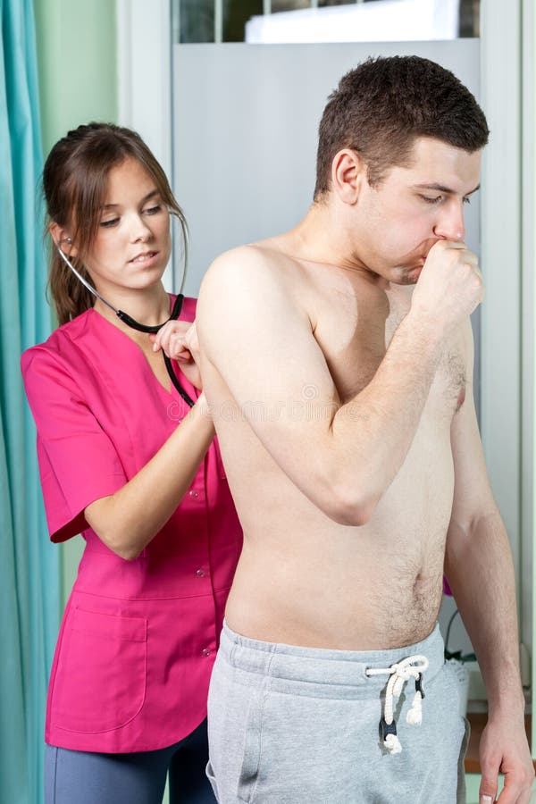 Female doctor examining young man royalty free stock images Female doctor examining young man royalty free stock images