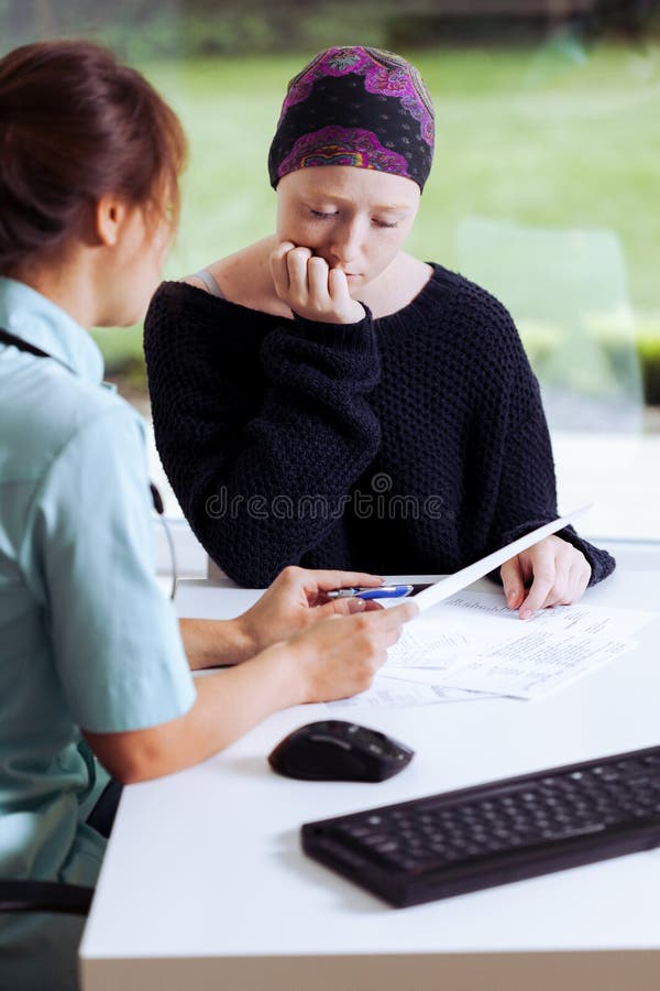 Female doctor examining young sick woman with cancer at hospital royalty free stock image Female doctor examining young sick woman with cancer at hospital royalty free stock image