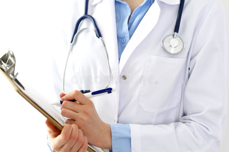 Female doctor filling up medical form on clipboard closeup. Physician finishing up examining his patient in hospital an