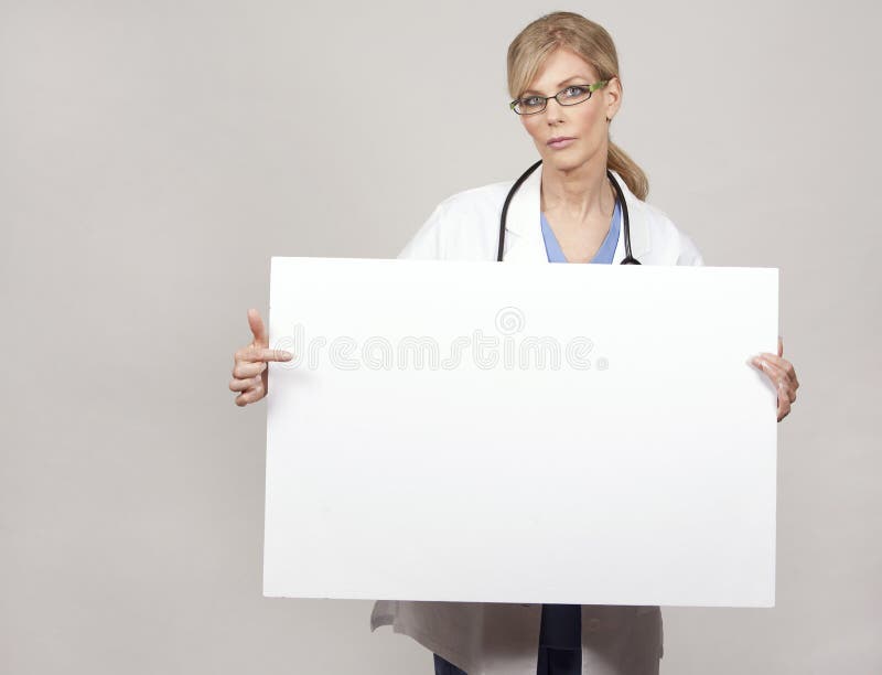 Female doctor holding board