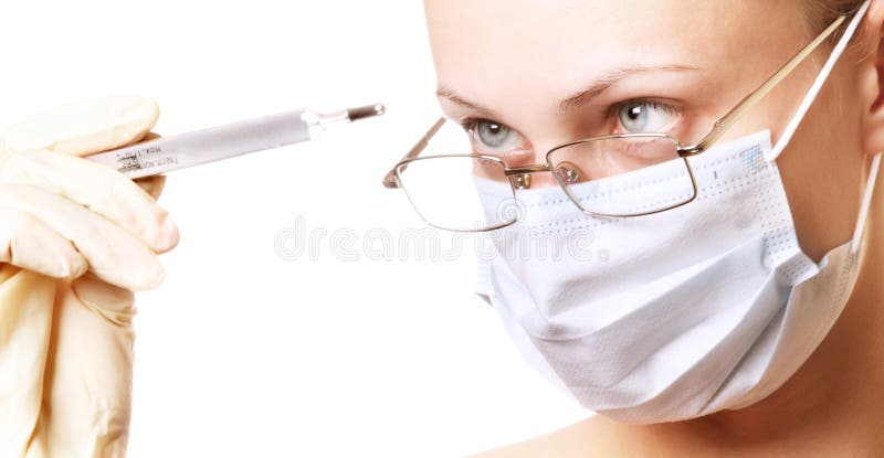 Female doctor looking on thermometer