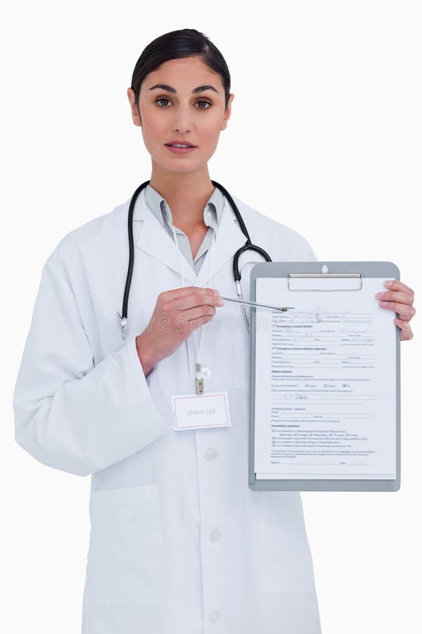 Female doctor pointing at form against a white background