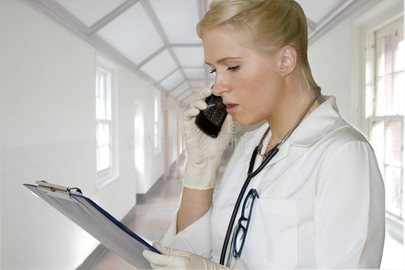 Female doctor talking over the phone