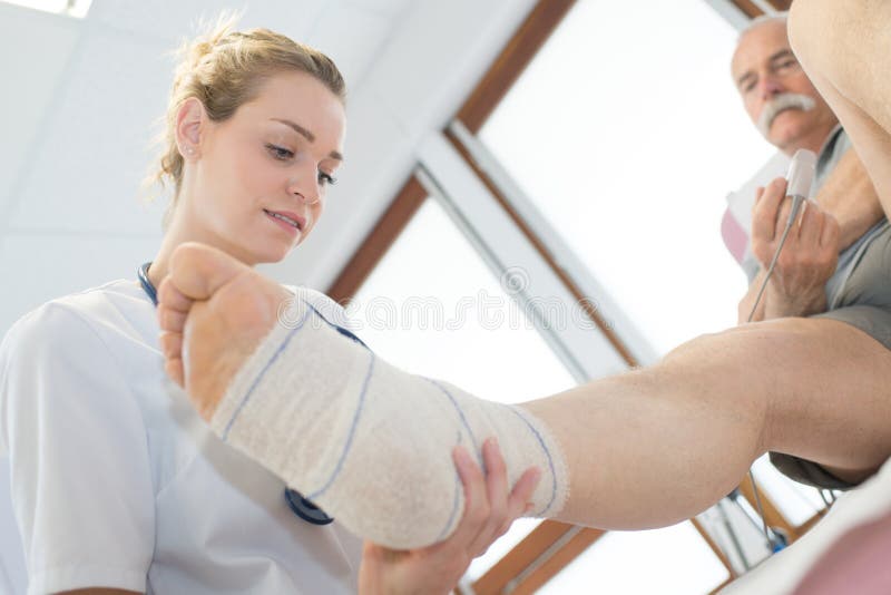 Female Doctor Touch Foot Patient