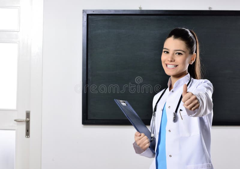 Attractive woman by blackboard. Multiracial hipster university college student pensive and contemplating looking up to the at empty blank copy space on chalkboard black background. Asian Caucasian, 20s. Attractive woman by blackboard. Multiracial hipster university college student pensive and contemplating looking up to the at empty blank copy space on chalkboard black background. Asian Caucasian, 20s.