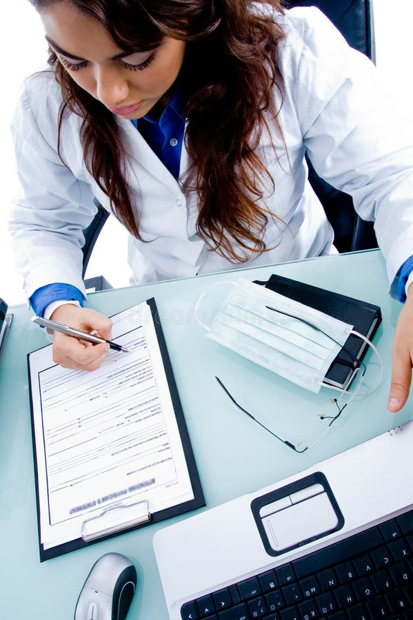 Female doctor writing prescription