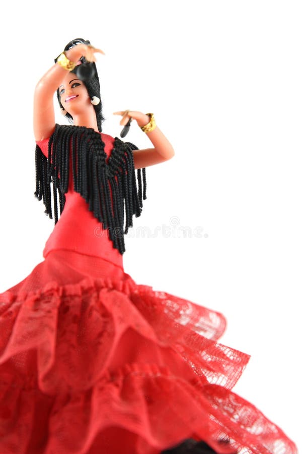 Female doll from Spain dancing flamenco on a white background