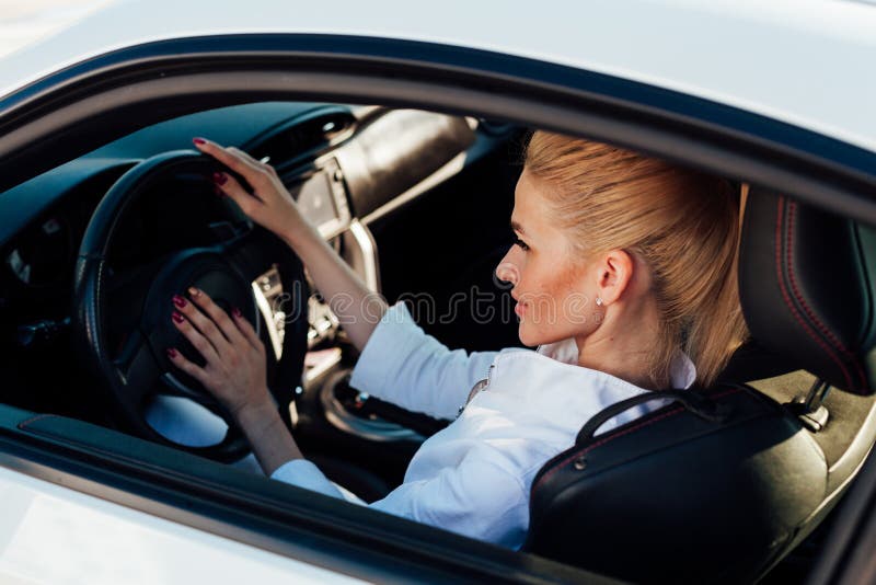 Female Driver Behind the Wheel of a White Car Stock Image Image of