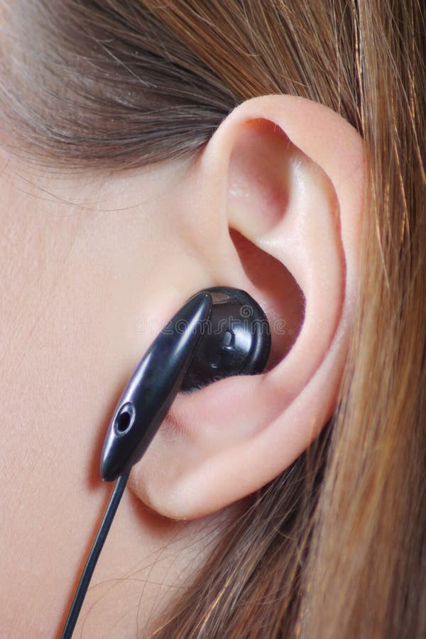 Female ear with an ear-phone