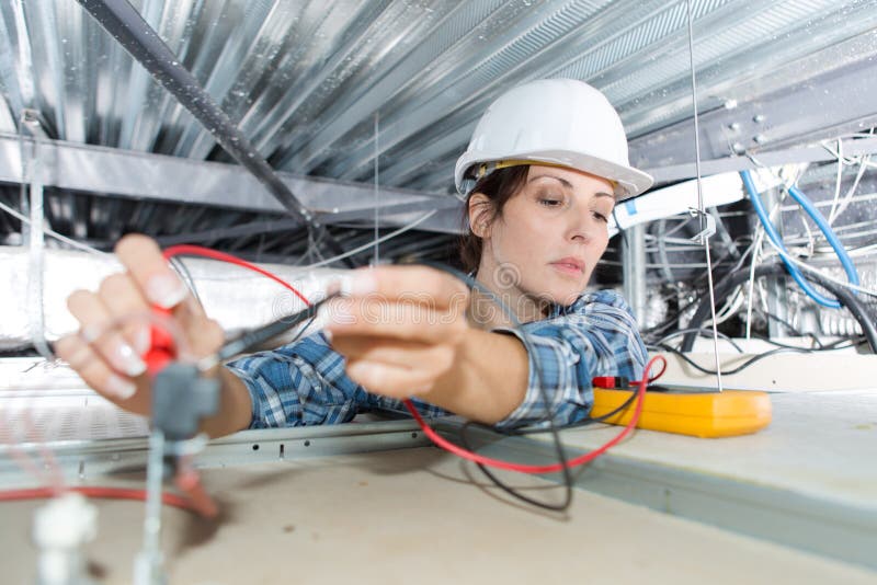 Female Electrician Checking Voltage Ceiling Cables Stock Image Image