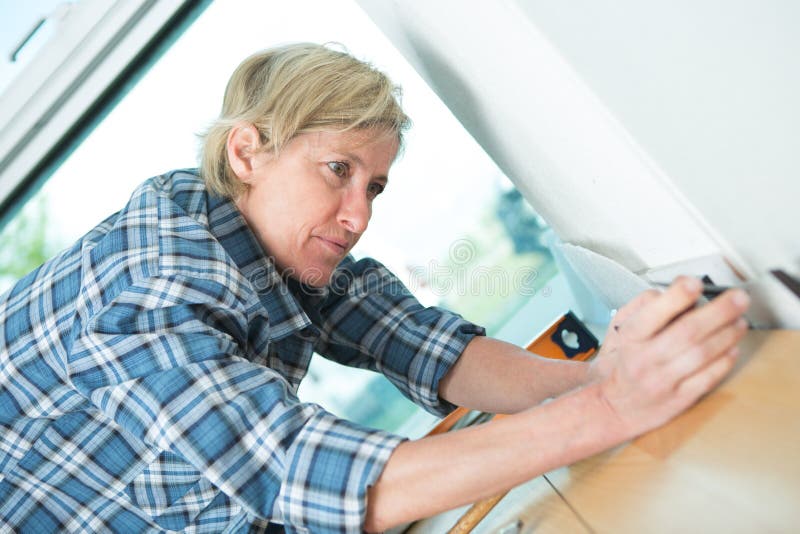 Female electrician fixing socket electricity problem royalty free stock photo Female electrician fixing socket electricity problem royalty free stock photo