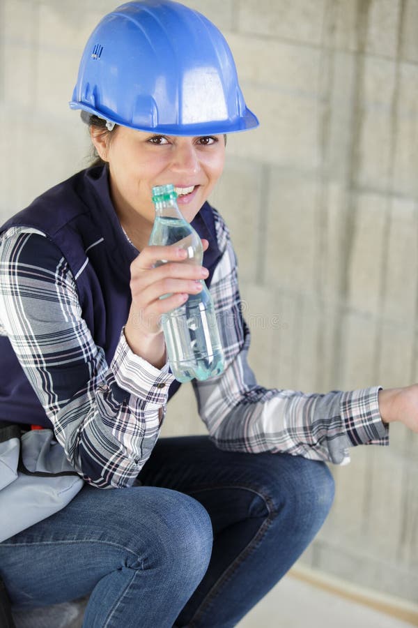 a female engineer drinking water