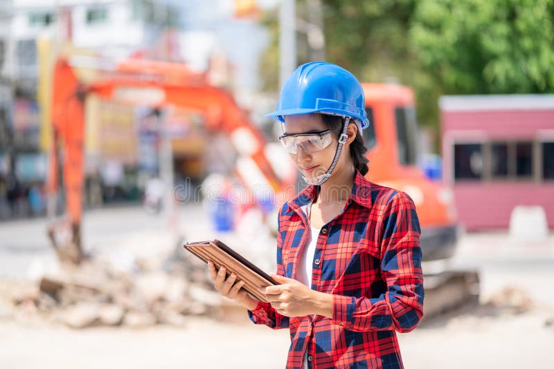 Female engineer is inspecting work at the construction site royalty free stock photos