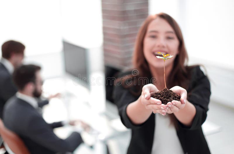 Female environmentalist showing fresh sprout royalty free stock image Female environmentalist showing fresh sprout royalty free stock image