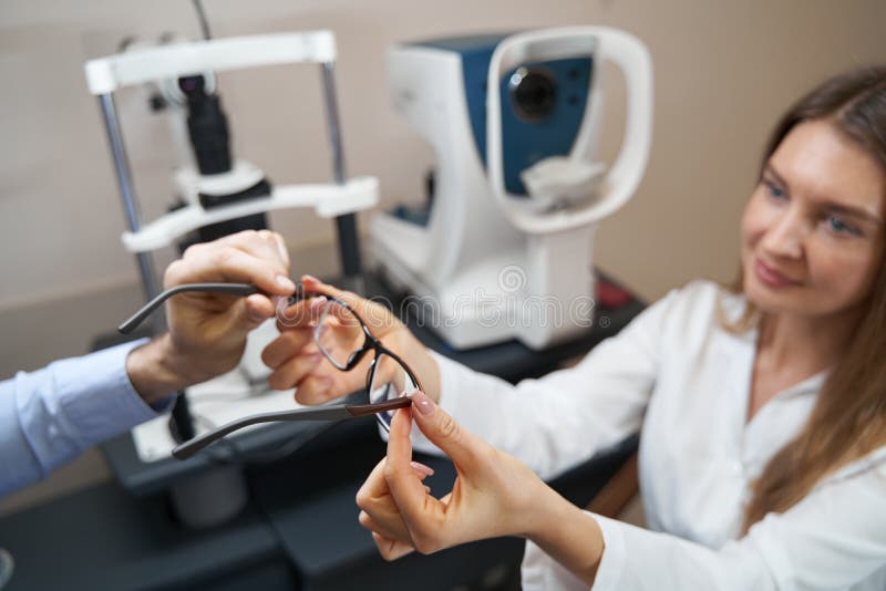 Optometrist Passing Glasses To The Patient After Examination Stock Image Image Of Give Health