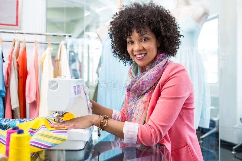 Female Fashion Designer Using Sewing Machine Stock Image - Image of ...