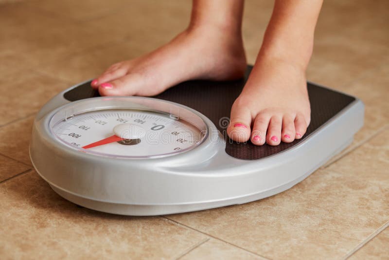 Female Feet On A Bathroom Scale Stock Photo Image of feet, loss 71327050