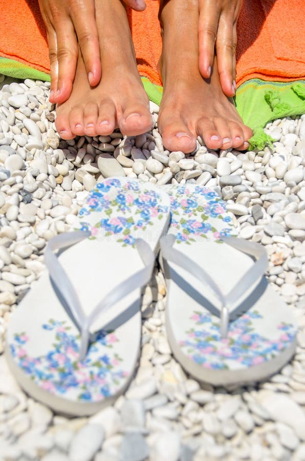 Female feet beach flip flops royalty free stock photography