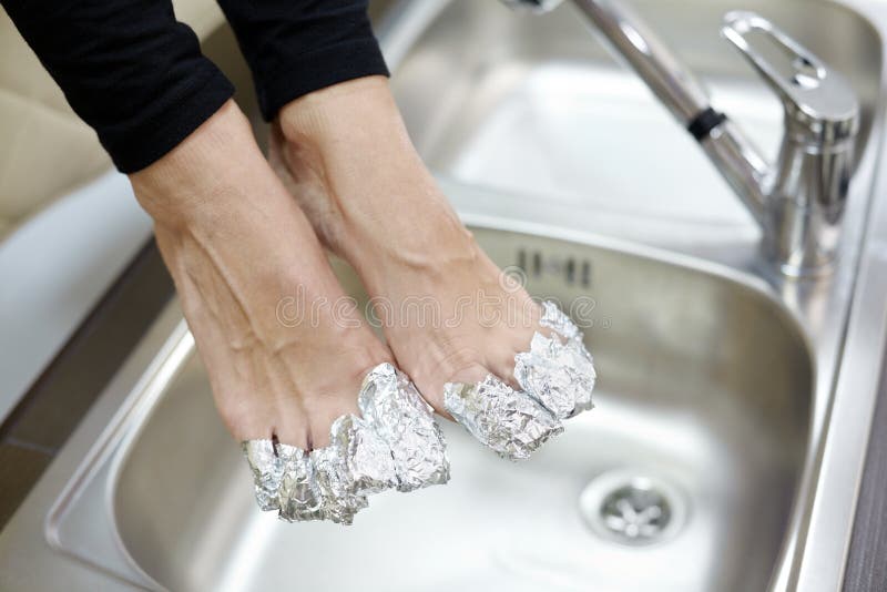 Female Feet with Fingers Wrapped in Foil. Stock Image Image of feet