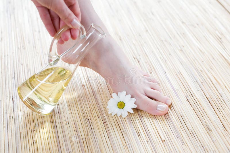 Female feet with oil royalty free stock photo