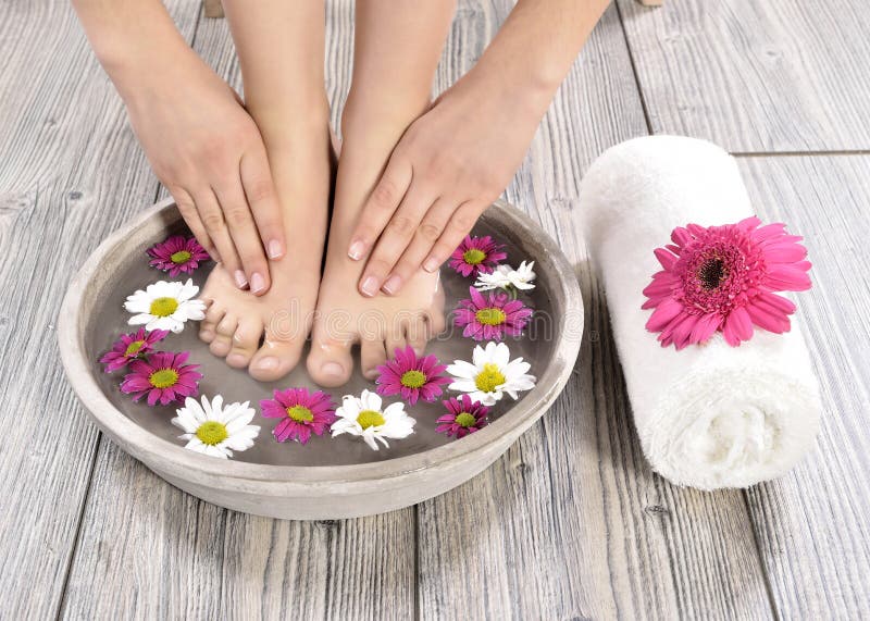 Female feet at spa salon on pedicure procedure