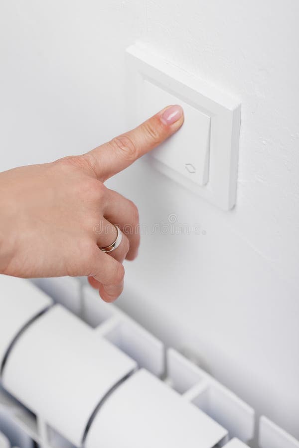 Finger turning off light switch royalty free stock images