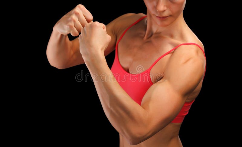 Female fitness bodybuilder posing against black background