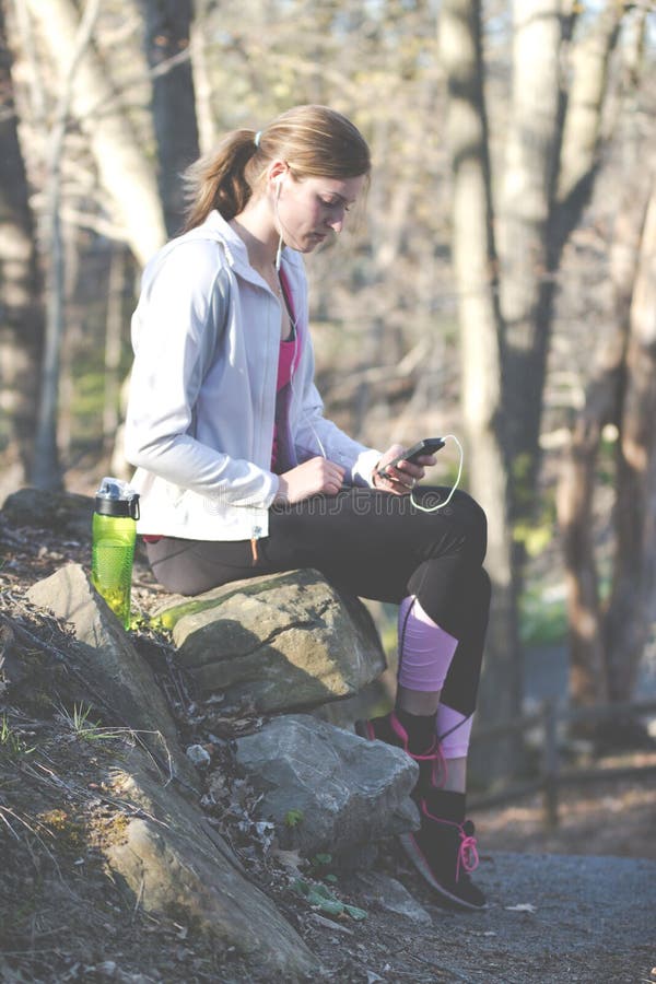 Female Fitness Model in Sports Bra with Hoodie on Nature Trail