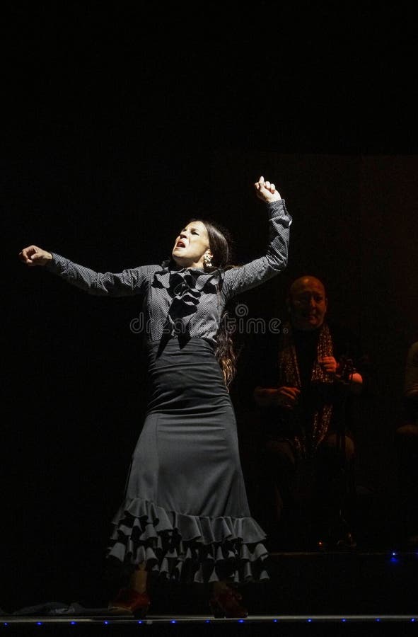 Female Flamenco Dancer and Singers Performing on Stage in Barcelona