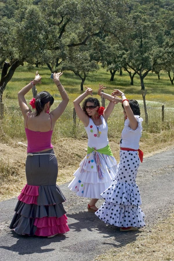 Female flamenco dancers in colorful dresses