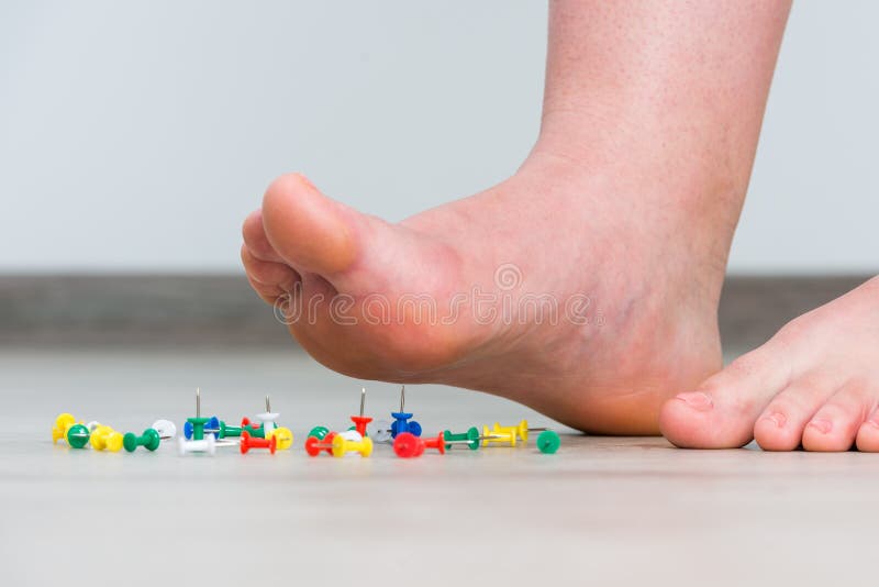 Female Foot Above Colored Pushpin Stock Photo - Image of appliance ...