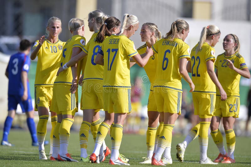 Female football players celebrating a goal