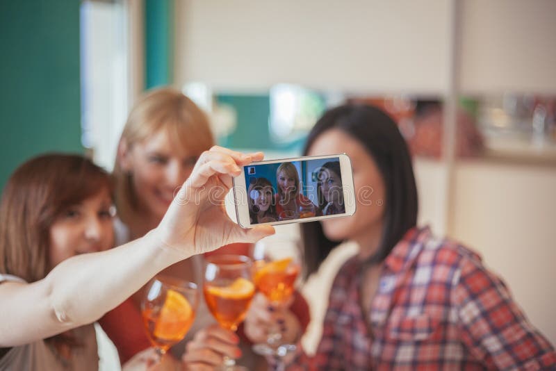 Female Friends Taking Selfie Stock Photo - Image of mobile, alcohol ...