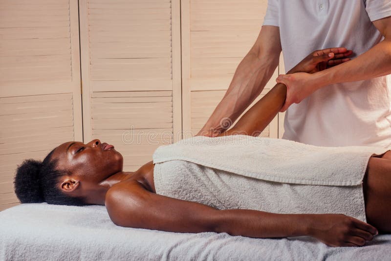 Beautiful African American Female Getting Ayurveda Massage Stock Image