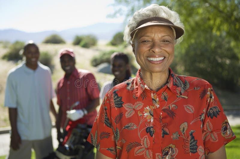 Female Golfer Smiling royalty free stock photo