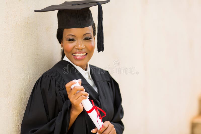 Female graduate holding diploma royalty free stock photos