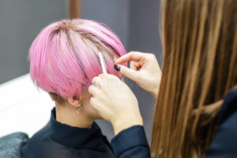 Female Hairdresser is Combing Short Pink Hair of Woman Stock Photo - Image  of equipment, brush: 163585846