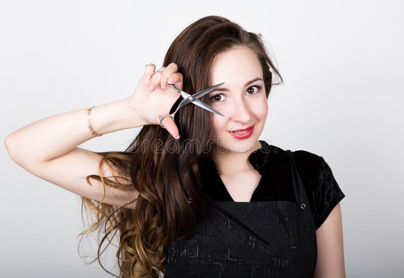 Female Hairdresser Shaping Mens Hair Cutting Uses Scissors in a Beauty