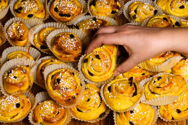 Female Hand Grabbing Saffron Bun Stock Photos Free & RoyaltyFree