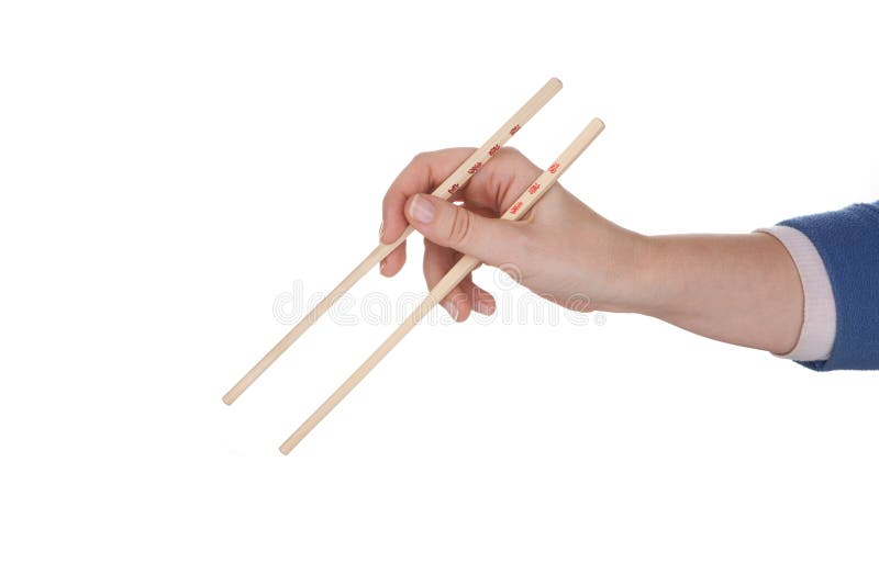 Female hand holding chopsticks royalty free stock image