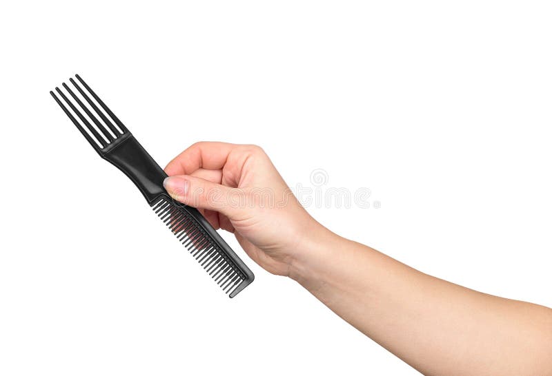 Female hand holding a comb for styling royalty free stock photos