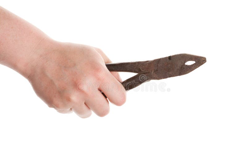 Female hand holding old pliers royalty free stock image