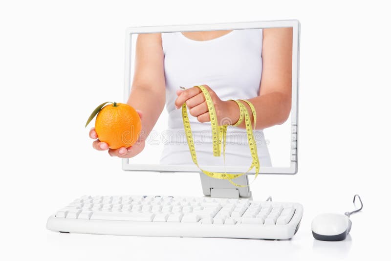 Female hand holding orange and measuring tape